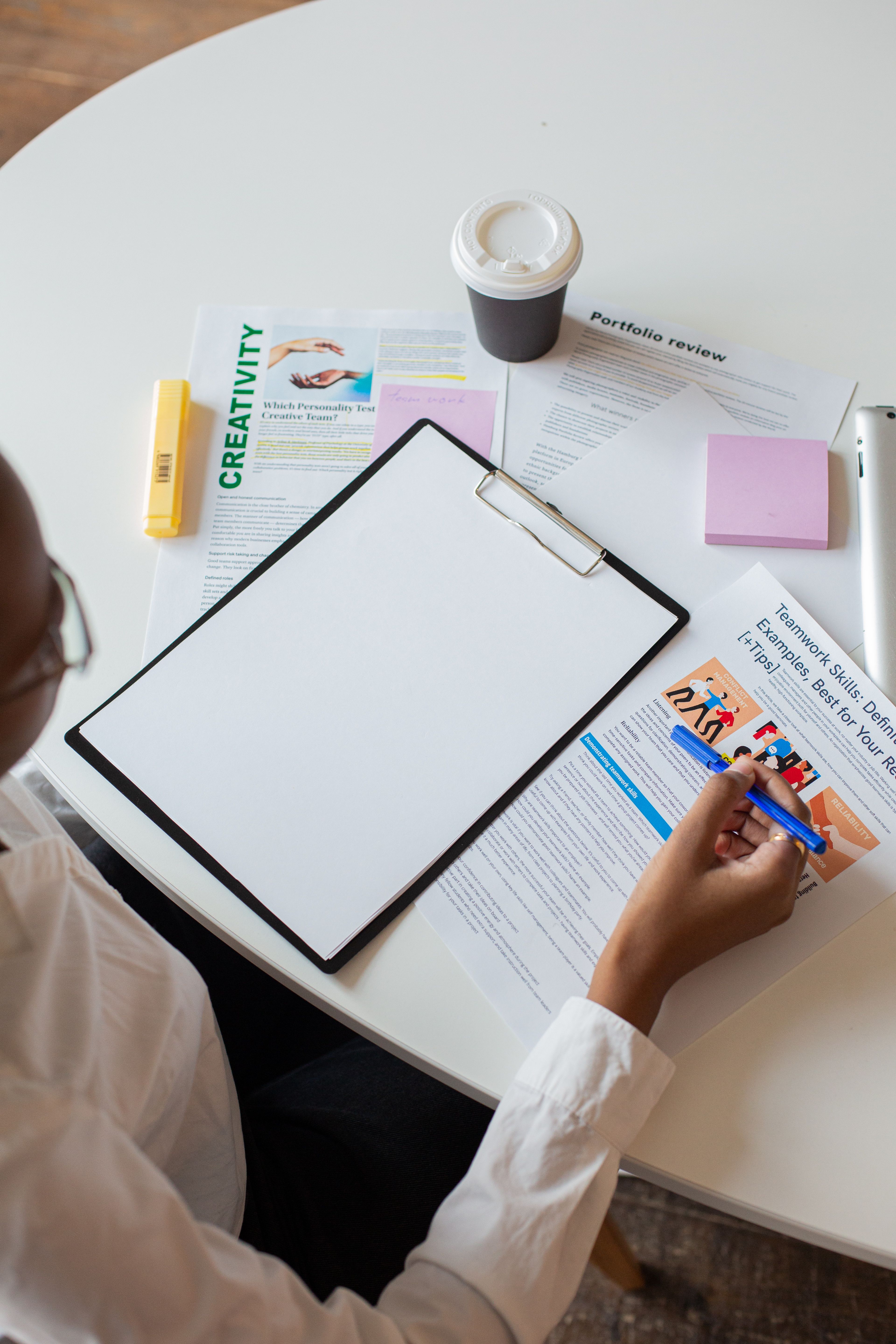Professional reviewing assessment materials on a clipboard